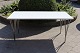 Piet Hein Sofabord i hvid laminat med metal kant. Designet af Arne Jacobsen og 
piet Hein, produceret af Fritz Hansen. 
5000m2 udstilling.
