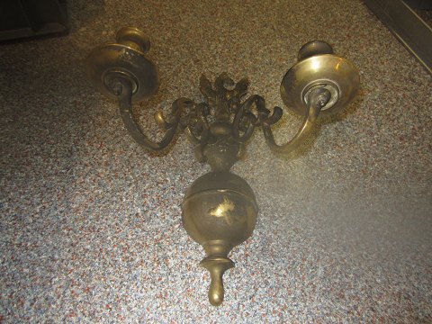 Wall lamp before and after restoration.
