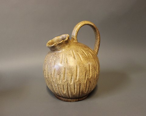 Ceramic jug in light brown colors by an unknown artist, numbered 219.
5000m2 showroom.