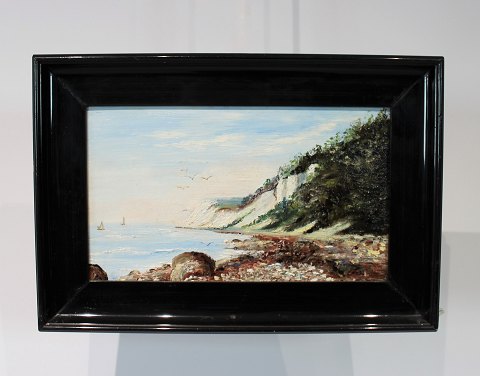 Small painting with  motif of Moens Klint and black frame, without signature.
5000m2 showroom.