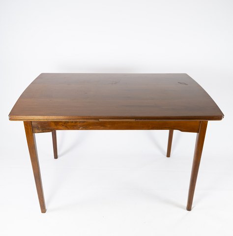 Spisebord i nøddetræ med hollandsk udtræk af dansk design fra 1960erne.
5000m2 udstilling.