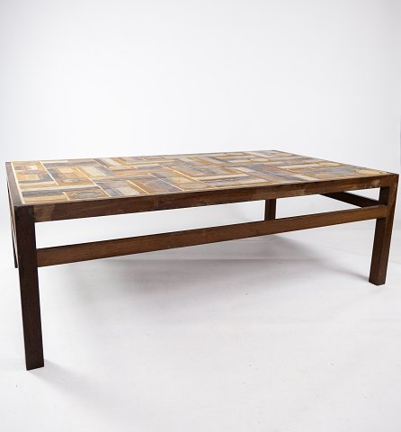 Coffee table in rosewood and dark tiles, designed by Tue Poulsen from the 1970s.
5000m2 showroom.