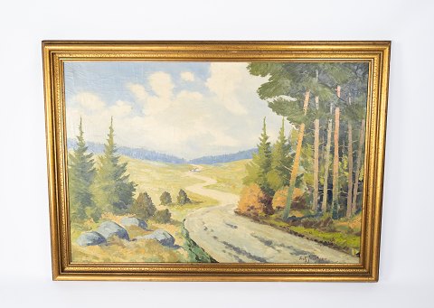Oil painting with forrest motif and gilded frame, signed Frits Jacobsen. 
5000m2 showroom.