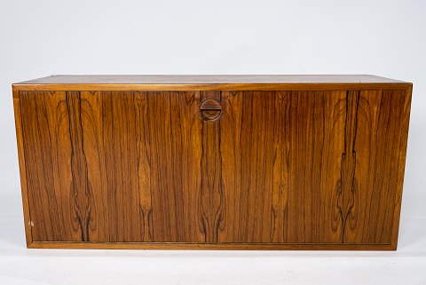 Wall mounted cabinet in rosewood of danish design from the 1960s. 
5000m2 showroom.