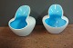 Small tealight cups in two-tones white / light blue from Holmegaard. 5000 m2 
showroom.
