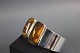Bangle in silver 925s with two large beautiful pieces of amber. Dia 6 cm. 
5000 m2 showroom.