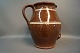 Large brown ceramic jug with white stripes.
5000m2 showroom.