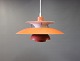 PH5 pendant in a redish color designed by Poul Henningsen and manufactured by 
Louis Poulsen.
5000m2 showroom.