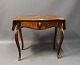 Beautiful antique table with inlaid Wood has been restored after extensive Water 
damage.
