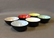 Small krenit bowls by Herbert Krenchel in Black metal and different coloured 
enamel.
5000m2 showroom.