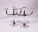 A pair of three armed candlesticks in 830 silver.
5000m2 showroom.