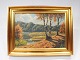 Painting with forest motif and gilded frame signed Finn Wennervald.
5000m2 showroom.