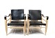 A pair of Safari Chairs - Black Grain Leather - Soap-Treated Beech - Aage Bruun 
& Son - 1960
