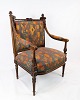 Armchair of polished dark wood and upholstered with fabric with pattern from 
around the 1890s.
5000m2 showroom.
