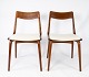 A papir of dining chairs, model Boomerang, in teak and light wool fabric 
designed by Alfred Christensen from the 1960s.
5000m2 showroom.