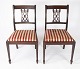 A pair of dining room chairs of mahogany and upholstered red fabric from the 
1960s. 
5000m2 showroom.