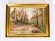 Oliemaleri med motiv skoven i efteråret og forgyldt ramme. fra 1920erne. 
5000m2 udstilling.