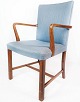 Armchair in mahogany and upholstered with light blue fabric by Fritz Hansen.
5000m2 showroom.