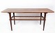Coffee table in teak with papercord shelf of Danish design from the 1960s.
5000m2 showroom.