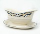 Sauce boat decorated with blue and yellow colours from the 1960s.
5000m2 showroom.