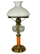 Kerosene lamp of brass with white opaline glass shade and orange glass stem, 
from around the 1860s. 
5000m2 showroom.
Great condition
